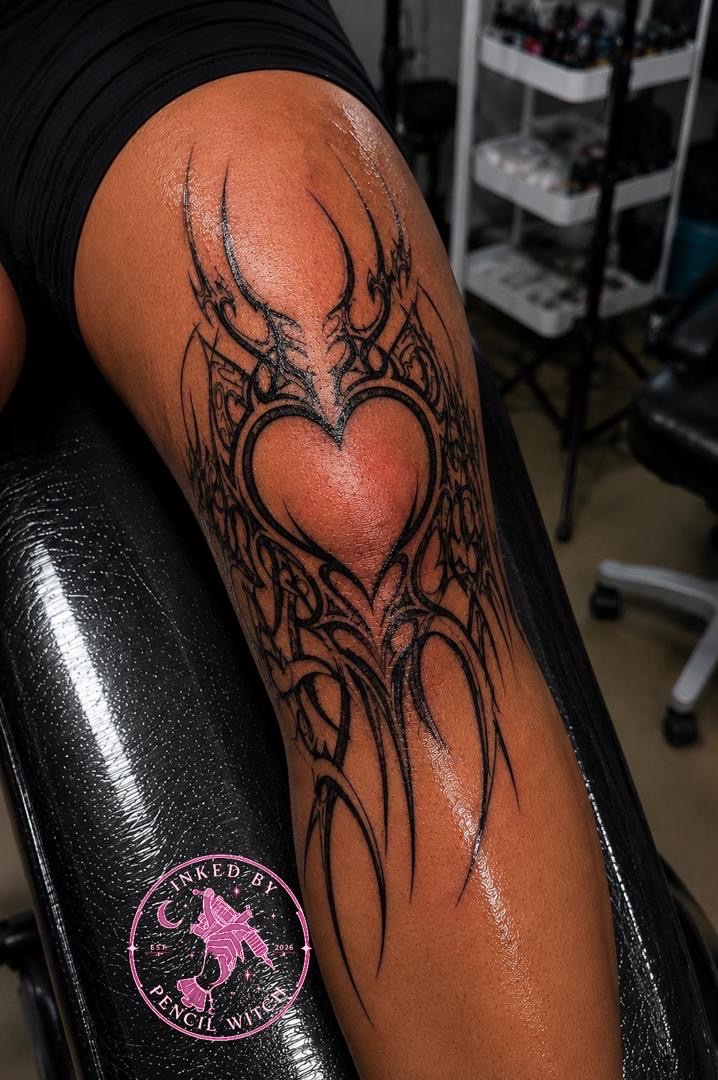 Small surreal tattoo of a meditating figure with a third eye